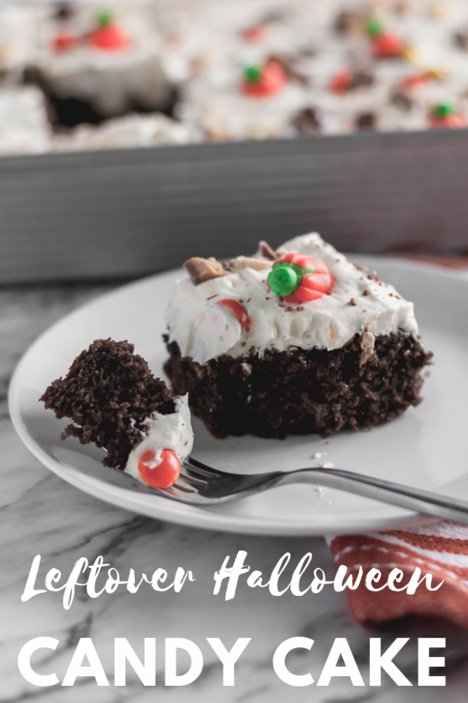 Leftover Halloween Candy Cake is the best way to use up your kids Halloween candy. A doctored up cake mix and 4 ingredient frosting for the win.