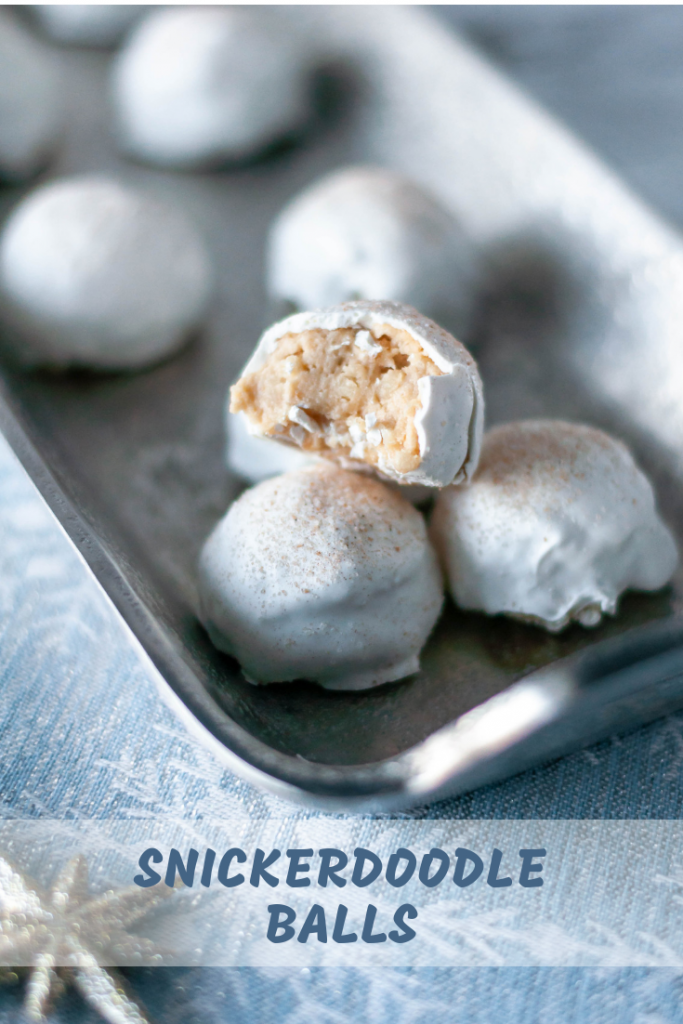 Snickerdoodle Balls are a fun spin on the classic Oreo Ball. Snickerdoodle cookies and cream cheese, dipped in white chocolate with a cinnamon sugar dusting