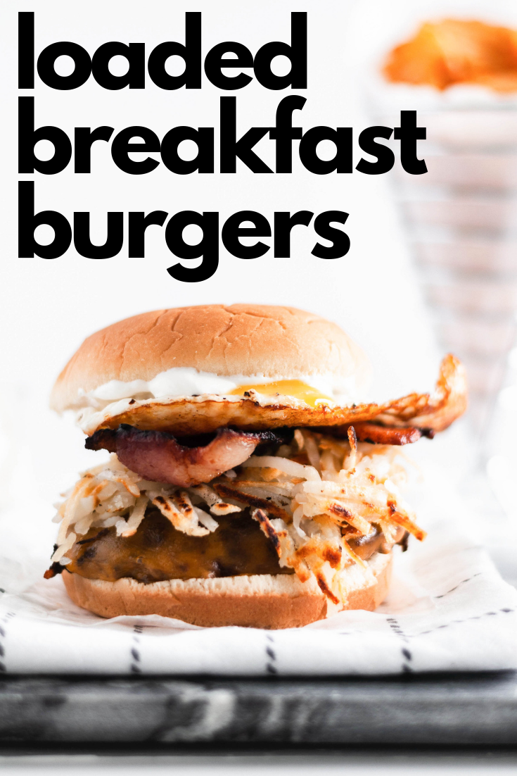 Make these Loaded Breakfast Burgers for dad this Father's Day. Juicy burgers topped with all the breakfast essentials, crispy hash browns, smoky bacon, drippy eggs and sharp cheddar cheese.