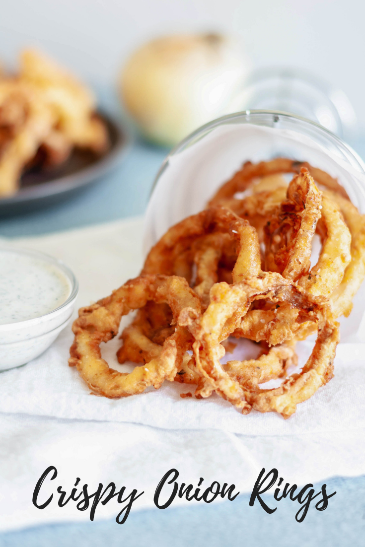 These Crispy Onion Rings with Buttermilk Dill Dressing will be the hit of the party. Perfect for appetizers, game day or to go with your burgers.