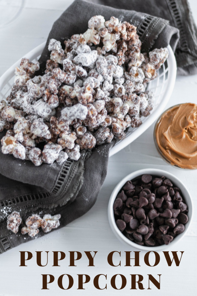 Up your movie night snacking game with this Puppy Chow Popcorn. Melted chocolate and peanut butter drizzled over popcorn and tossed with powdered sugar for the ultimate sweet treat.