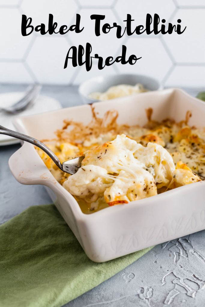 This Baked Tortellini Alfredo is the ultimate comfort food. Cheese tortellini tossed in alfredo sauce, topped with mozzarella and baked to perfection.