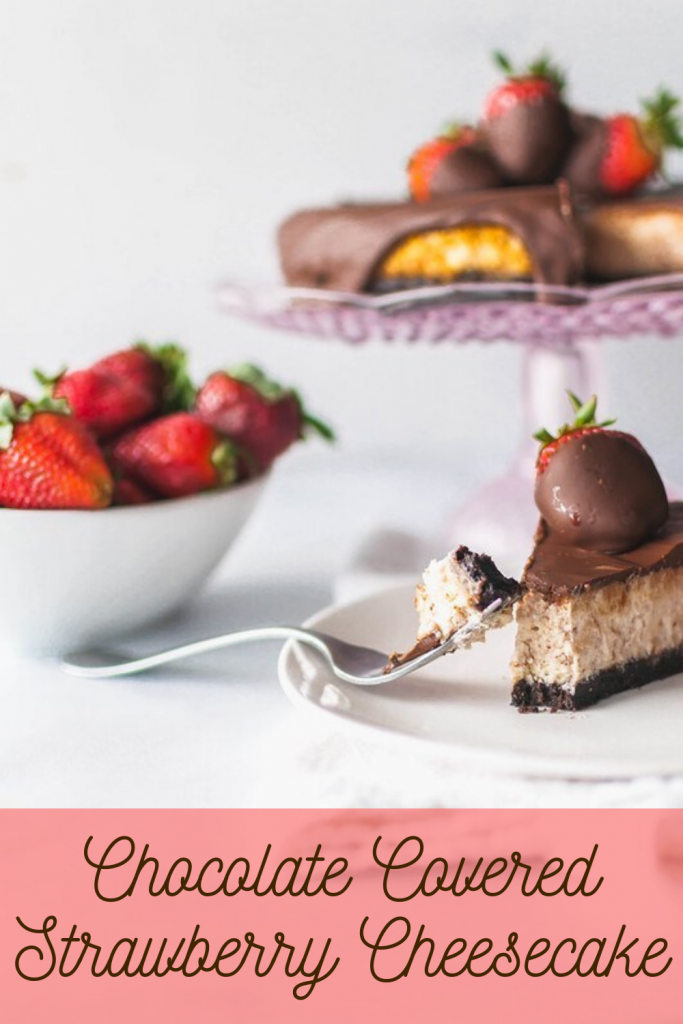This sweet, creamy Chocolate Covered Strawberry Cheesecake is the ultimate dessert. Strawberry scented cheesecake topped with a delicious chocolate ganache and decorated with chocolate strawberries.