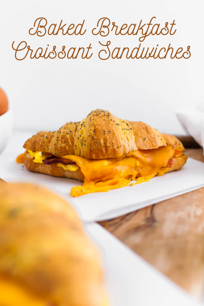 These Baked Breakfast Croissant Sandwiches start with a buttery, flaky croissants and are filled with scrambled eggs, crisp bacon and melted cheddar cheese to create a delicious hand held breakfast to enjoy at home or on the go.