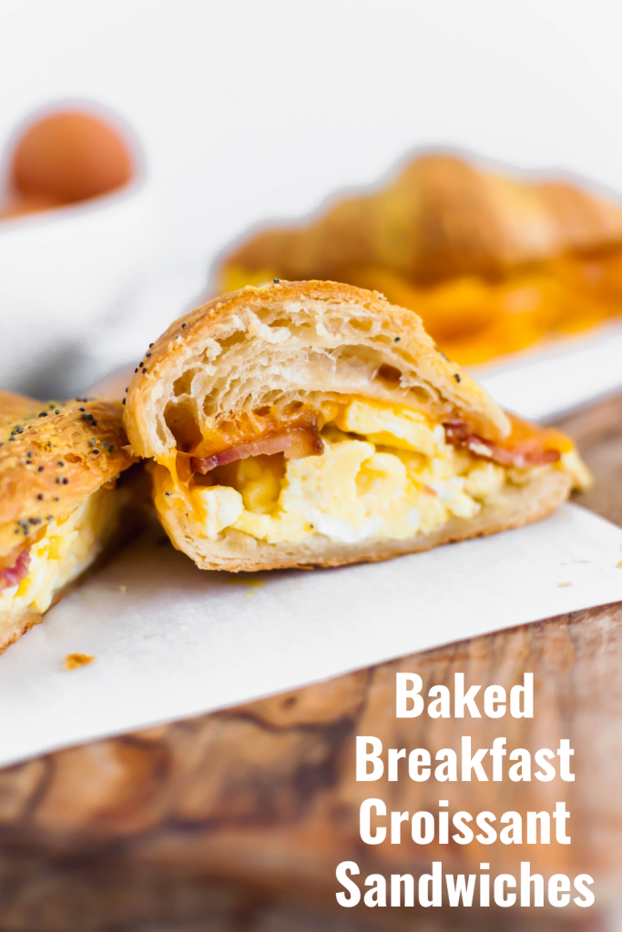 These Baked Breakfast Croissant Sandwiches start with a buttery, flaky croissants and are filled with scrambled eggs, crisp bacon and melted cheddar cheese to create a delicious hand held breakfast to enjoy at home or on the go.