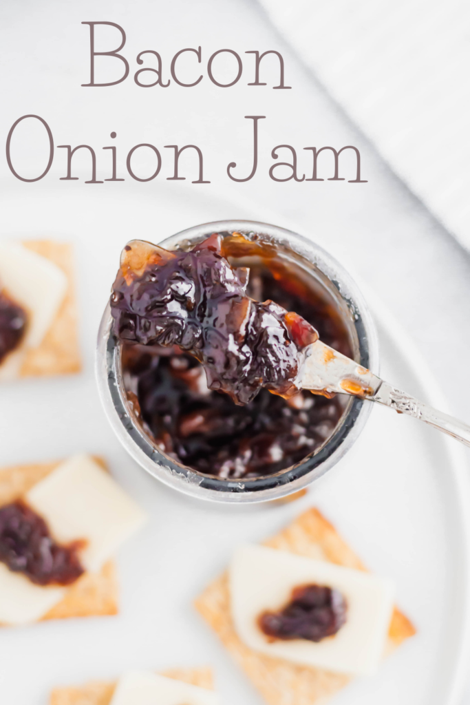 Bacon Onion Jam is a delicious, sweet and savory condiment that is going to blow your mind. Smoky bacon, red onions, sugar and vinegar are cooked down to create a thick, caramelized jam that is delicious on crackers, sandwiches, brie and more.