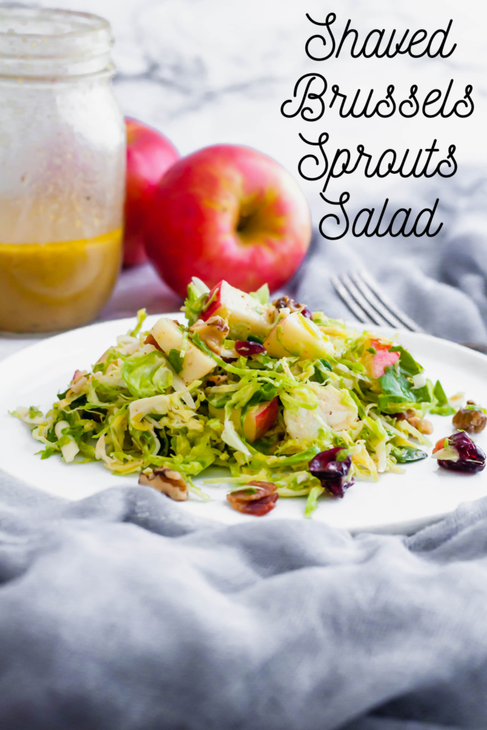 This Shaved Brussels Sprouts Salad is the perfect addition to your Thanksgiving table. It's bringing all the fresh fall vibes. Full of fresh shaved brussels sprouts, honeycrisp apples, craisins, sharp cheddar cheese, toasted walnuts and the most delicious honey mustard vinaigrette. Prepare the ingredients ahead of time and toss together at the last minute for a stress free holiday dinner.