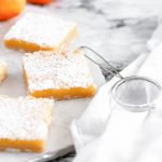 Classic Meyer Lemon Bars are a great option for Easter dessert. Simple to make with a great sweet, tart zing. Crumbly, sweet shortbread and tart meyer lemon filling.