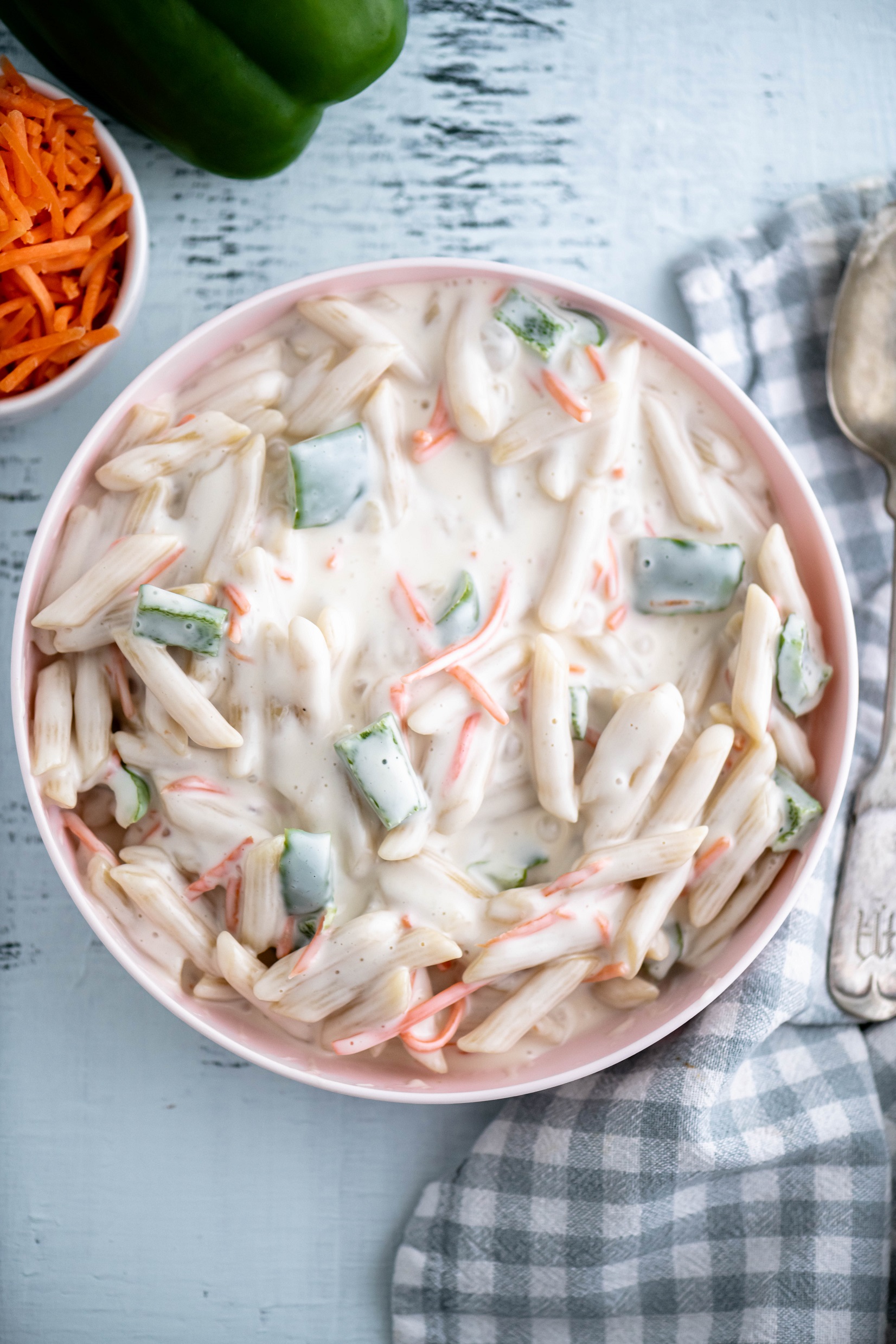 This unique Sweet Macaroni Salad will be a hit at your next barbecue. Simple ingredients combine to make a sweet and zingy macaroni salad that everyone will adore.