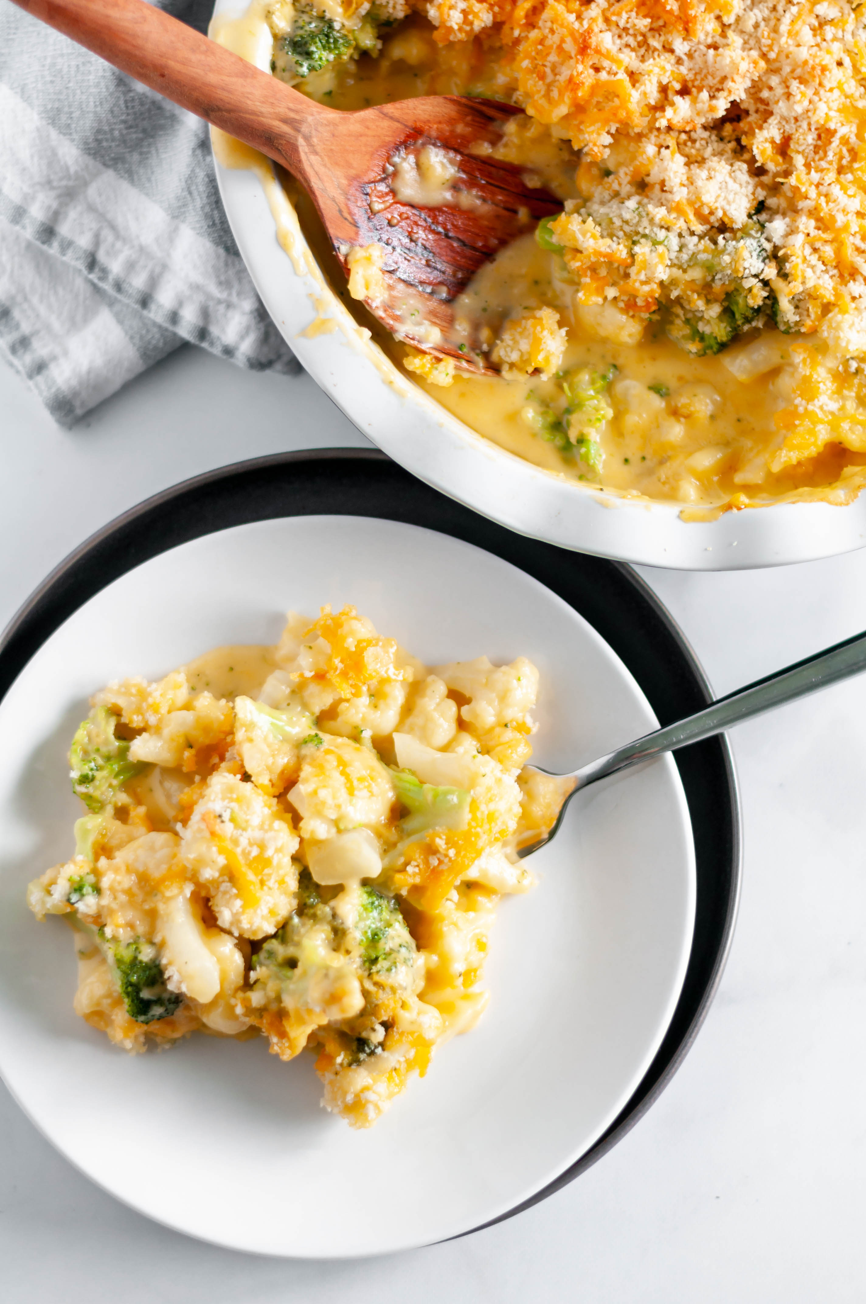 Broccoli and Cauliflower Au Gratin is a favorite side dish for every holiday. Rich, homemade cheese sauce, broccoli and cauliflower with a crispy panko topping.