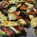 Baked Loaded Jalapeno Poppers are the ultimate appetizer for game day or movie night. Loaded with cream cheese and sausage then wrapped in bacon.