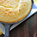 Sweet cornbread is baked in a cast iron skillet to produce a brown crispy bottom which is just perfect to accompany your favorite chili or soup.