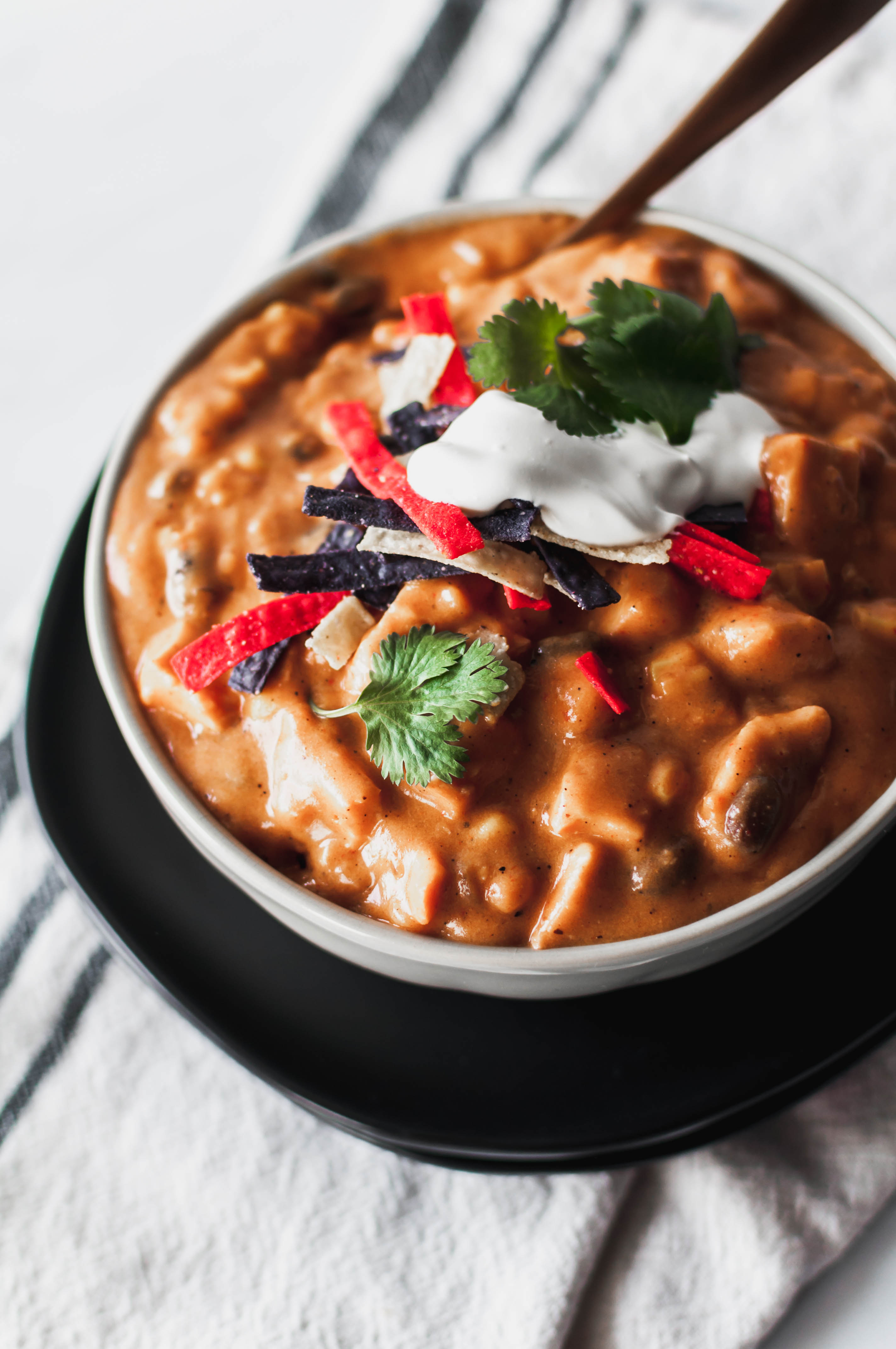 Chicken Enchilada Soup is a Chili's copycat and our favorite soup ever. Cheesy, spicy, creamy and filling.