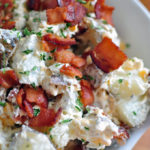 This Loaded Baked Potato Salad is loaded with all your favorite potato toppings. Sour cream, shredded cheddar cheese and lots of bacon.