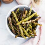 These easy Roasted Green Beans make a super easy weeknight side dish. 20 minutes from start to finish. Use fresh green beans for the most amazing flavor.