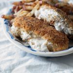 Chicken breaded in all the spices from an everything bagel then stuffed with cream cheese creates the ultimate indulgence. Use that extra seasoning for some baked french fries and you have an entire meal with this Cream Cheese Stuffed Everything Chicken with Everything Fries. Yum!