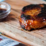 Bacon Wrapped Bourbon Glazed Pork Chops are a fancy way to celebrate something special at home. Bourbon, brown sugar, soy sauce and more.