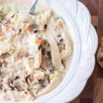 This Cheesy Chicken Wild Rice Soup is creamy, warm and hearty on these cool fall days. Shredded chicken, wild rice and veggies bulk up the lightly cheesy soup base to create the perfect dinner for your family.