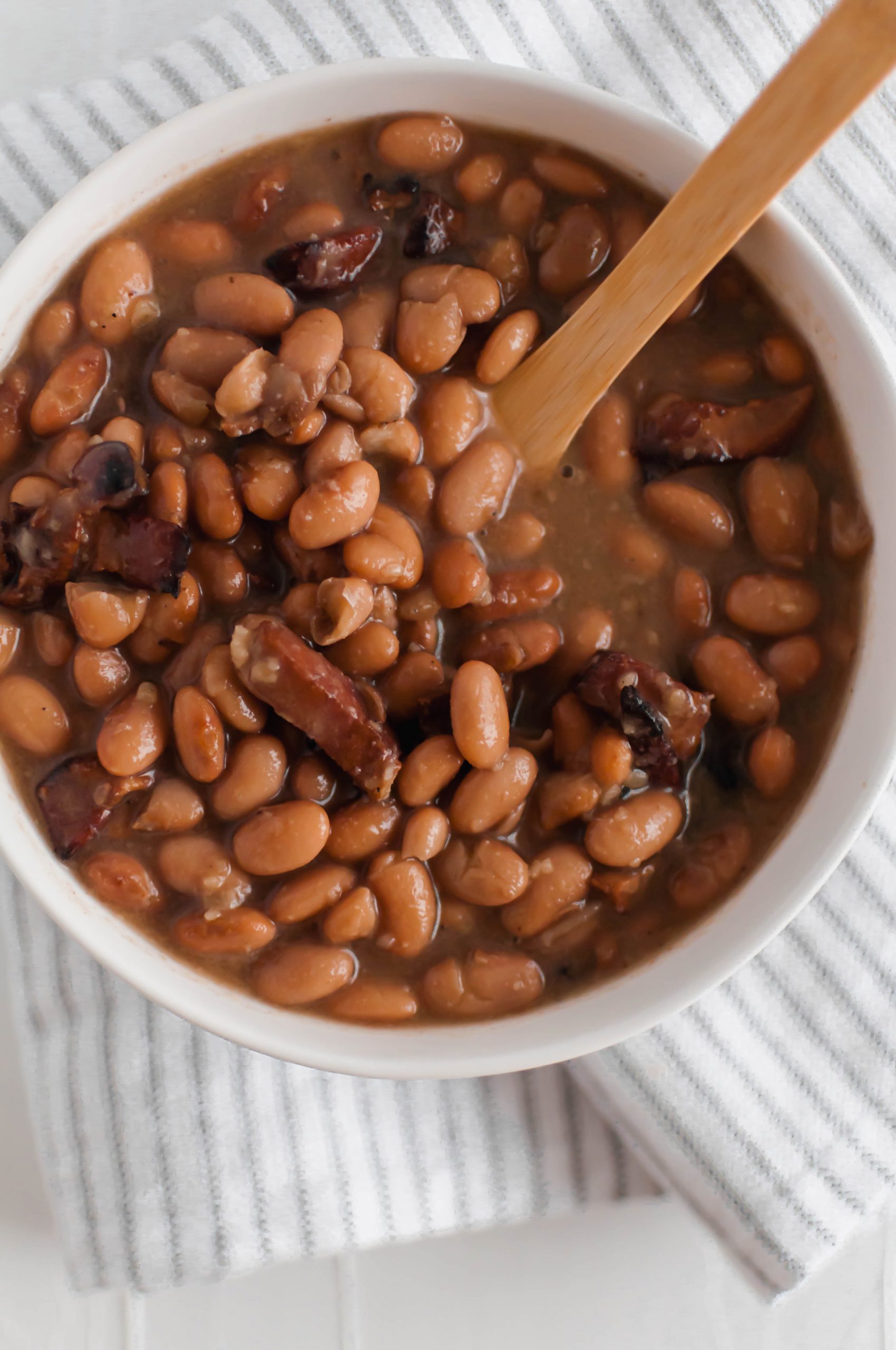 If you love Chipotle’s pinto beans, look no further because now you can make them at home. Dried pinto beans cook all day in the slow cooker with bacon, onion and garlic to make these flavorful Bacon Pinto Beans. Perfect for rice bowls, nacho night or even on their own.