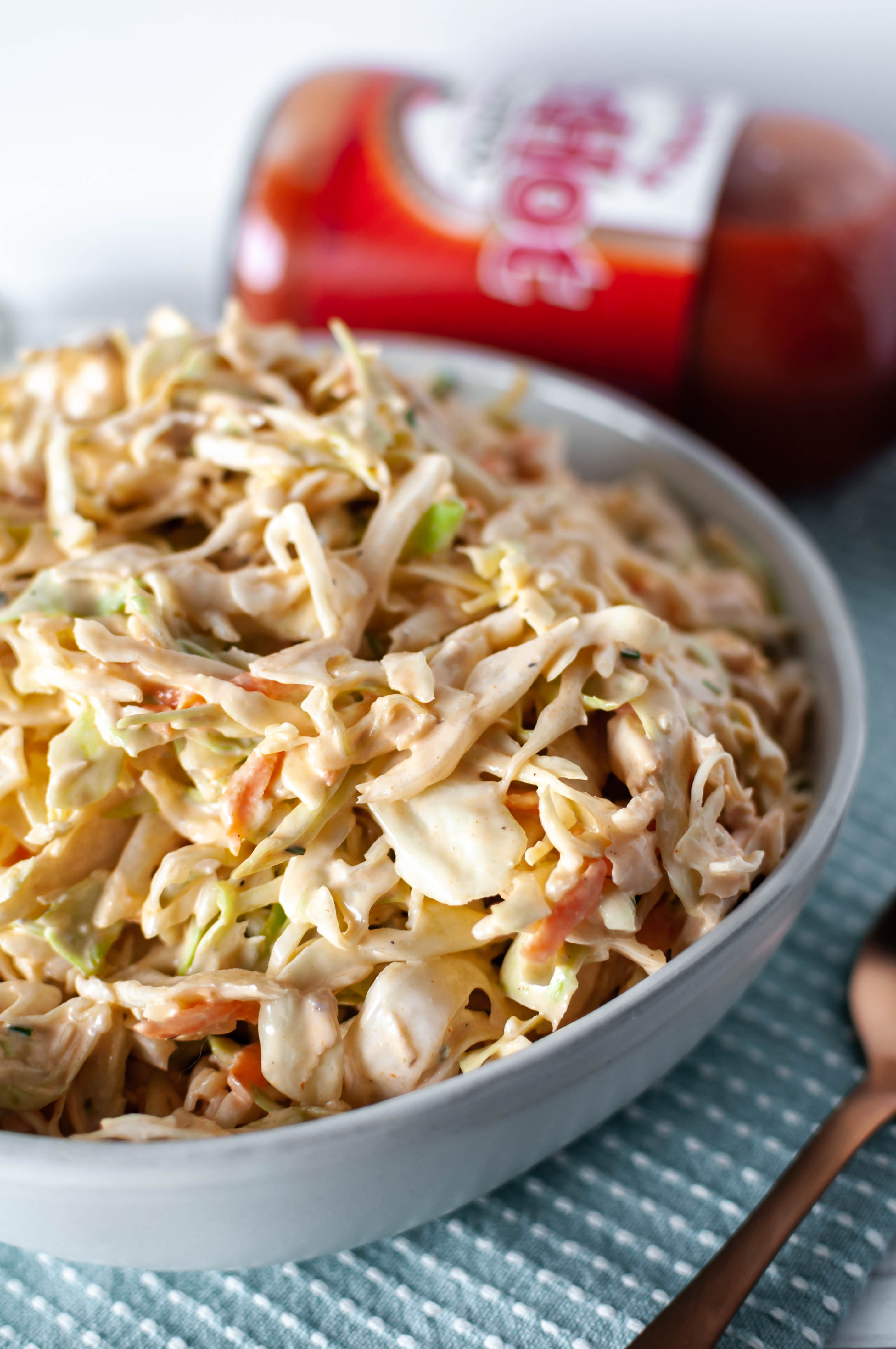 A classic American dish and a favorite flavor combine into one crazy delicious side dish. Buffalo Chicken Coleslaw is super creamy, slightly spicy and tangy and perfect for your next summer potluck.