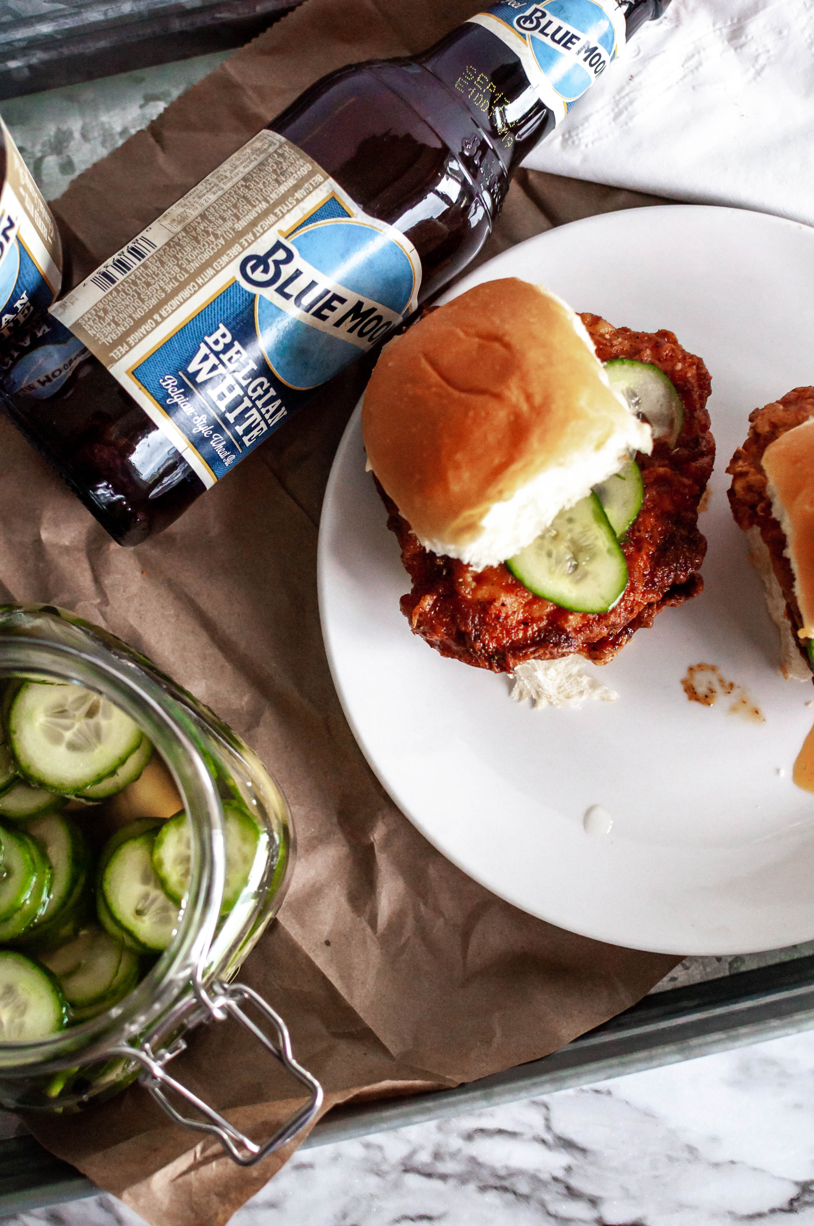 Hot Chicken Sliders with Quick Pickles are the ultimate game day food. Soft, buttery bread, crispy fried chicken, spicy sauce and fresh, crunchy pickles.