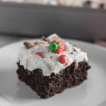 Leftover Halloween Candy Cake is the best way to use up all the kids Halloween candy. Some store-bought short cuts including a doctored up cake mix and 4 ingredient whipped frosting.