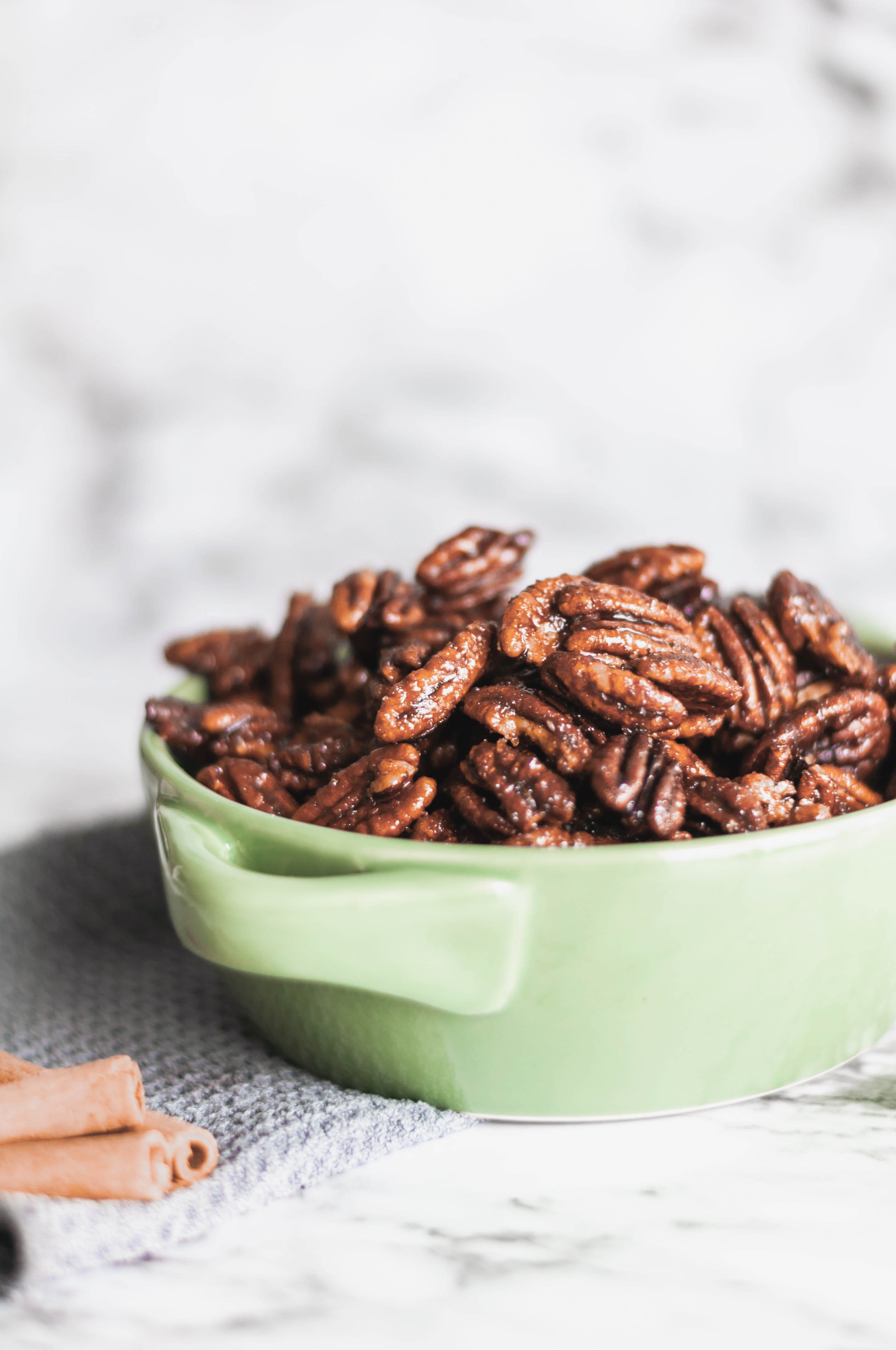 Cinnamon Sugar Pecans are a lovely sweet treat. Warm cinnamon and brown sugar caramelize over toasted pecans to make a great snack or dessert. Perfect for your Christmas baking.