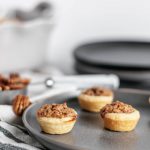 Mini Pecan Pies are a simple and totally delicious option for dessert this Thanksgiving. Quick homemade crust and sweet pecan filling.