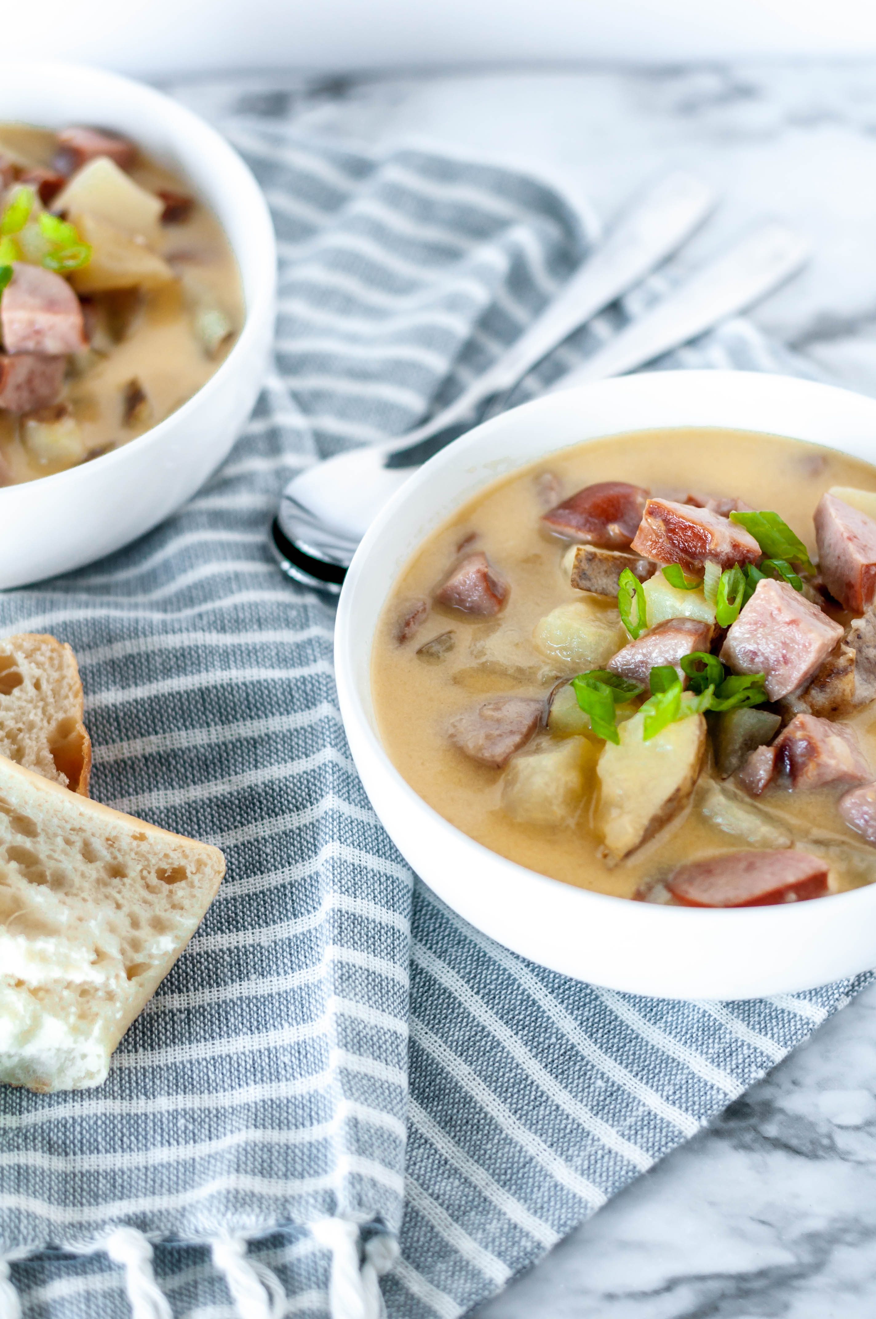 Cheesy Sausage Potato Soup is just what you need this winter. Soft potatoes, flavorful smoked sausage in a cheesy broth makes an easy weeknight meal.