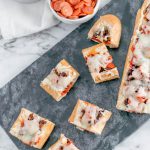 French Bread Pizza Bites make a simple appetizer with just a handful of ingredients. Perfect appetizer for the Super Bowl.
