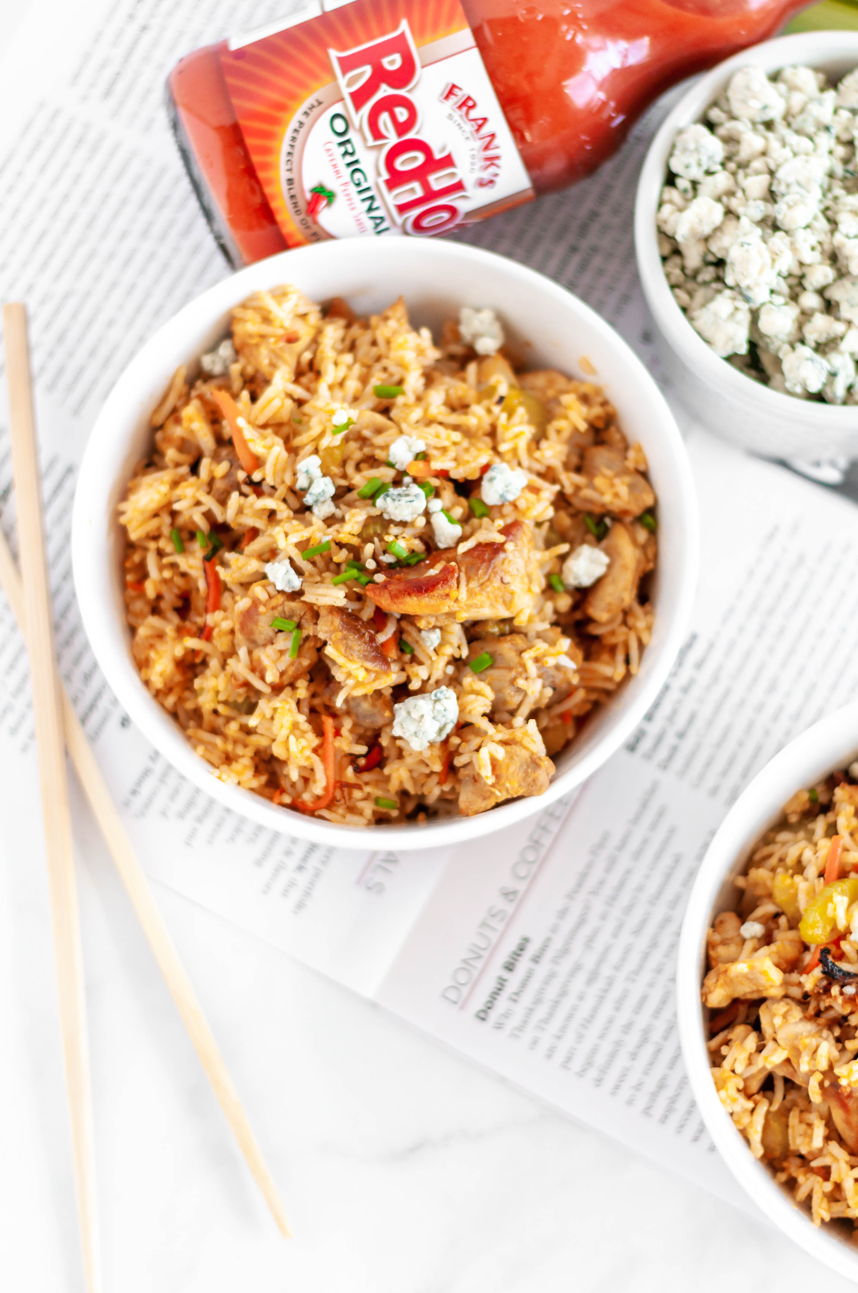 Buffalo Fried Rice is a super simple, flavorful and spicy dinner you can whip up in less than 30 minutes with some leftover rice. Spicy buffalo chicken, carrots, celery and buffalo sauce with a sprinkle of crumbled blue cheese.