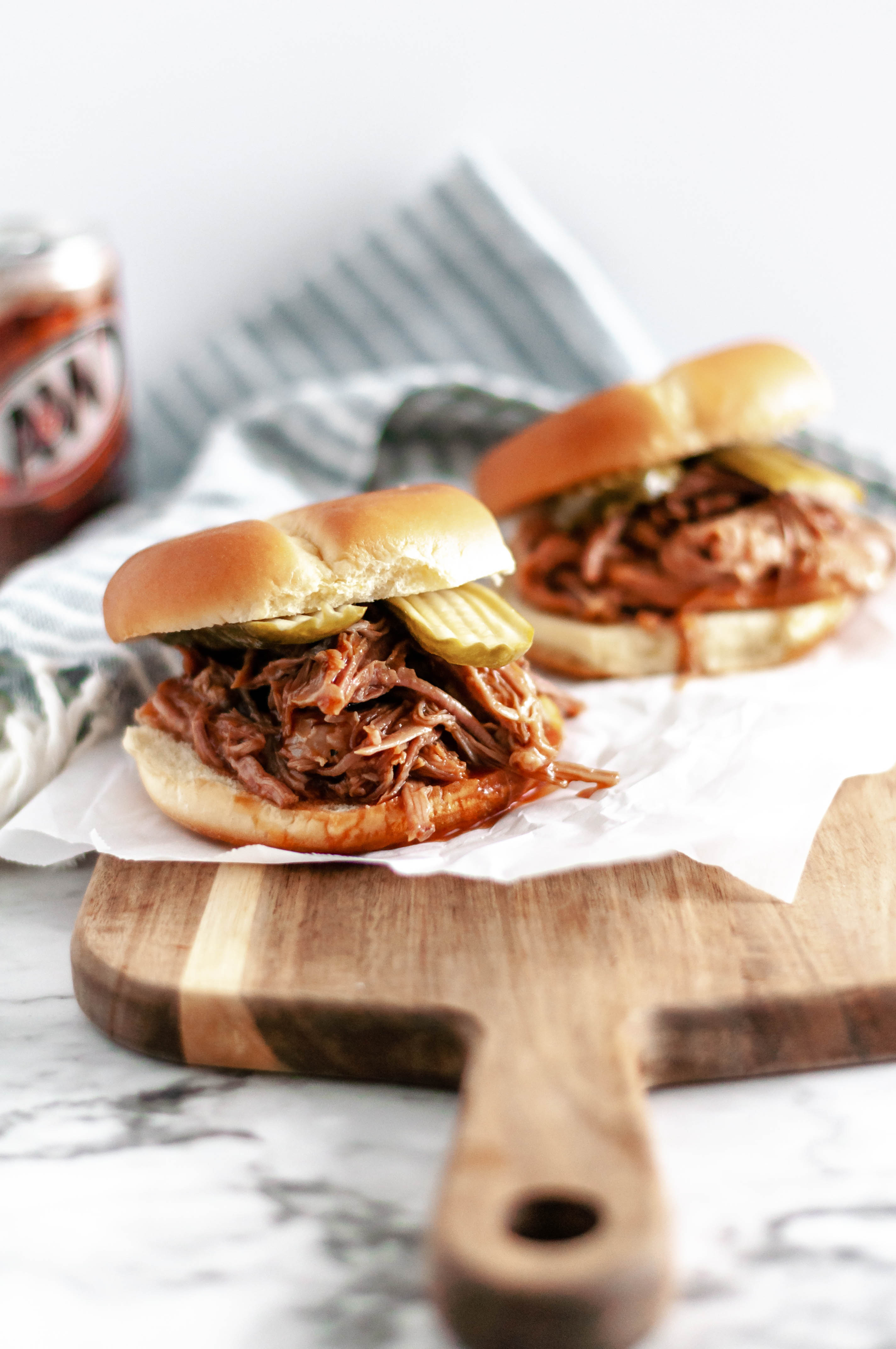 Rootbeer BBQ Pulled Pork Sandwiches are super simple to make in the slow cooker. Four ingredients & hours in the slow cooker to tender, saucy perfection.