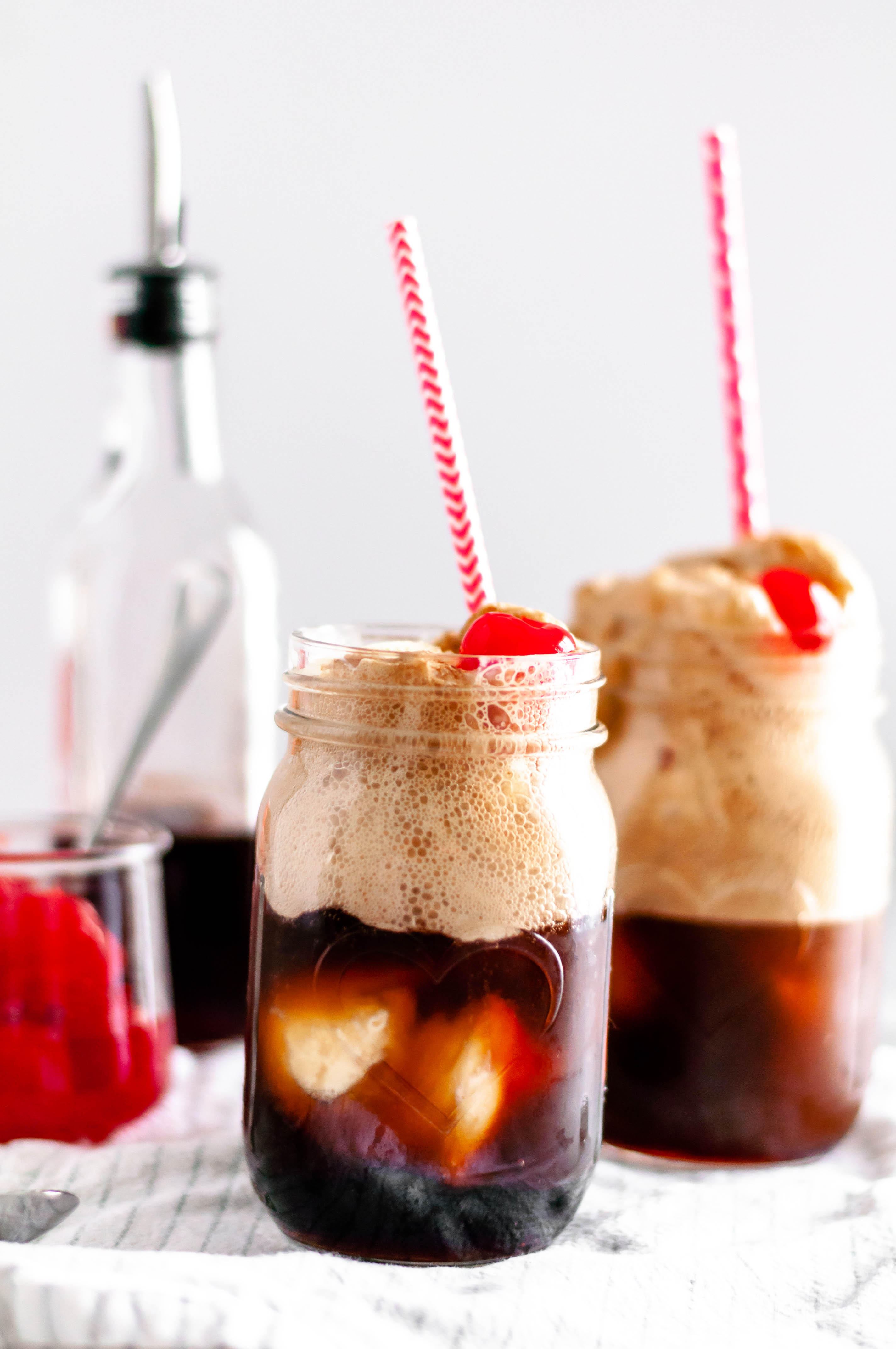 These Cherry Vanilla Coke Floats will make the sweetest dessert this Valentines day. Homemade cherry vanilla syrup, vanilla ice cream and coke.