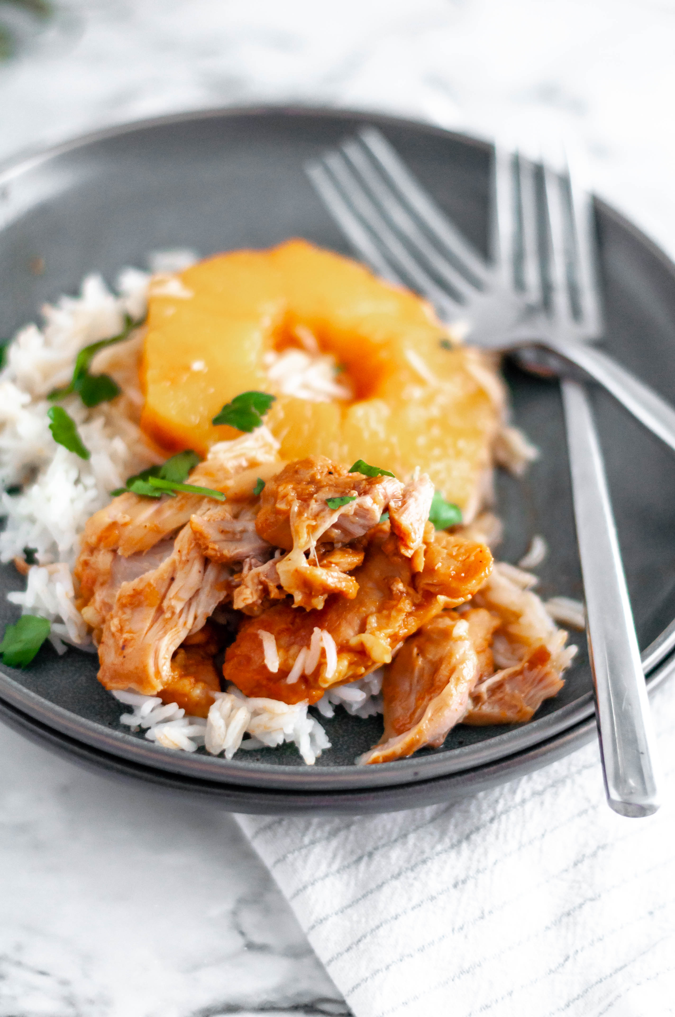 Pineapple BBQ Instant Pot Chicken is packed full of flavor and yields a super tender chicken. Serve over rice for a super simple and quick weeknight meal.