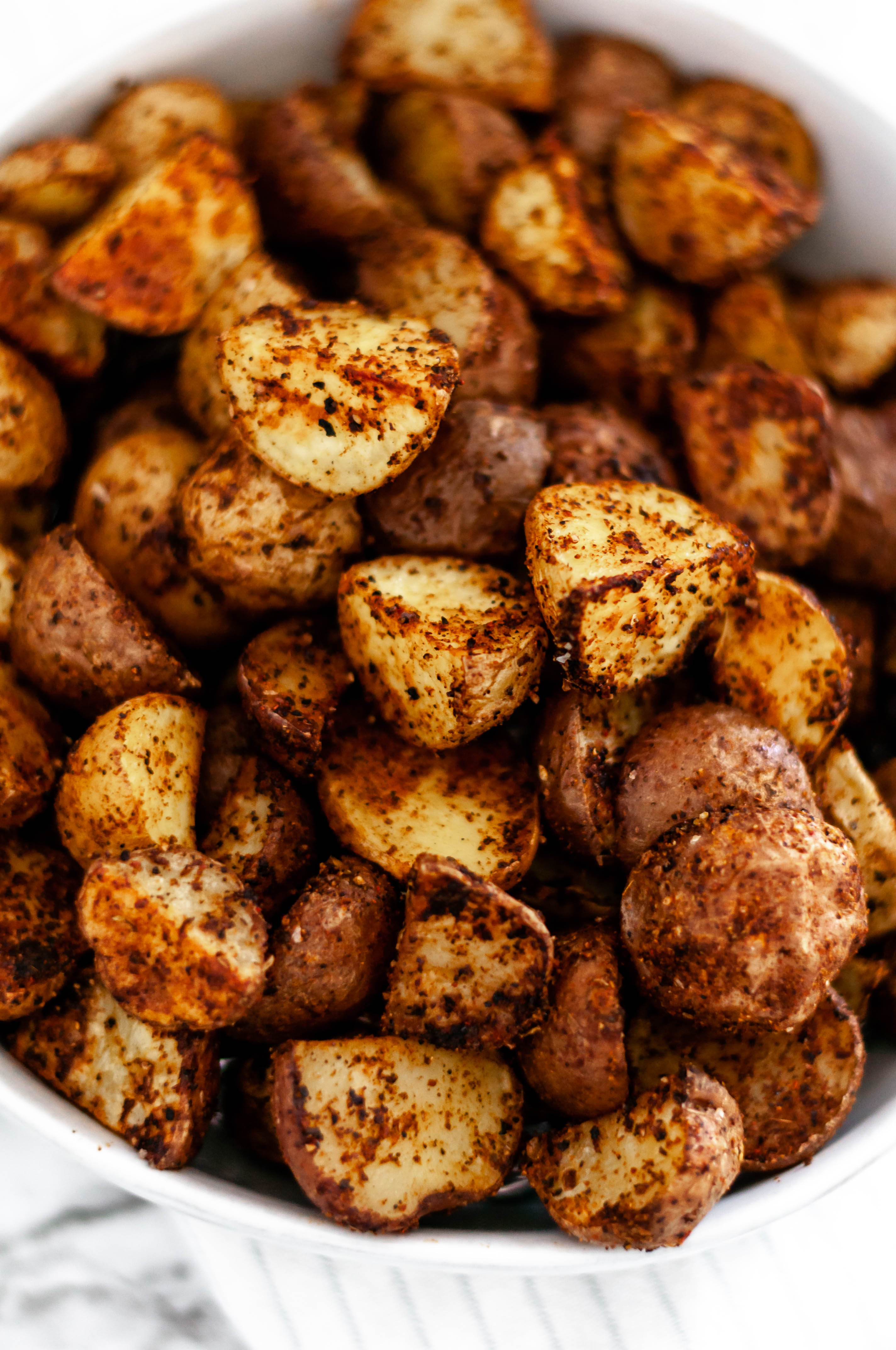 These Taco Roasted Potatoes are spiced up with your favorite taco spices. They make the perfect weeknight side dish, done in less than 30 minutes.