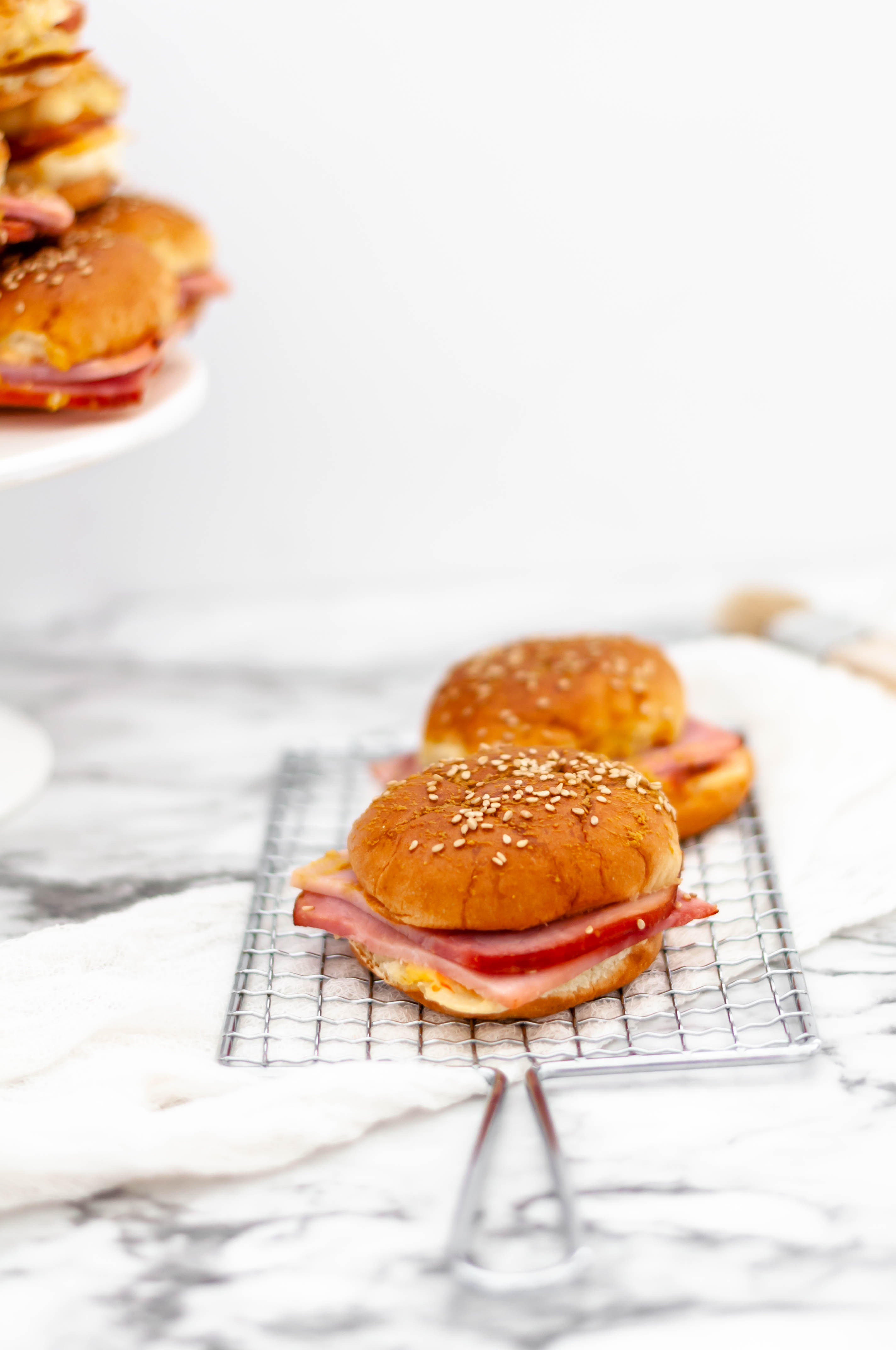 Put that leftover Easter ham to good use and make these Southern Ham Sliders. Sweet Hawaiian slider buns, creamy, flavorful pimento cheese and leftover ham slices make dinner a snap.