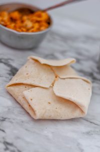Meet your new craving, the Buffalo Chicken Crunch Wrap. Spicy buffalo chicken, mozzarella cheese, blue cheese and a crispy tostada shell all wrapped up in a soft flour tortilla and cooked to crispy perfection.