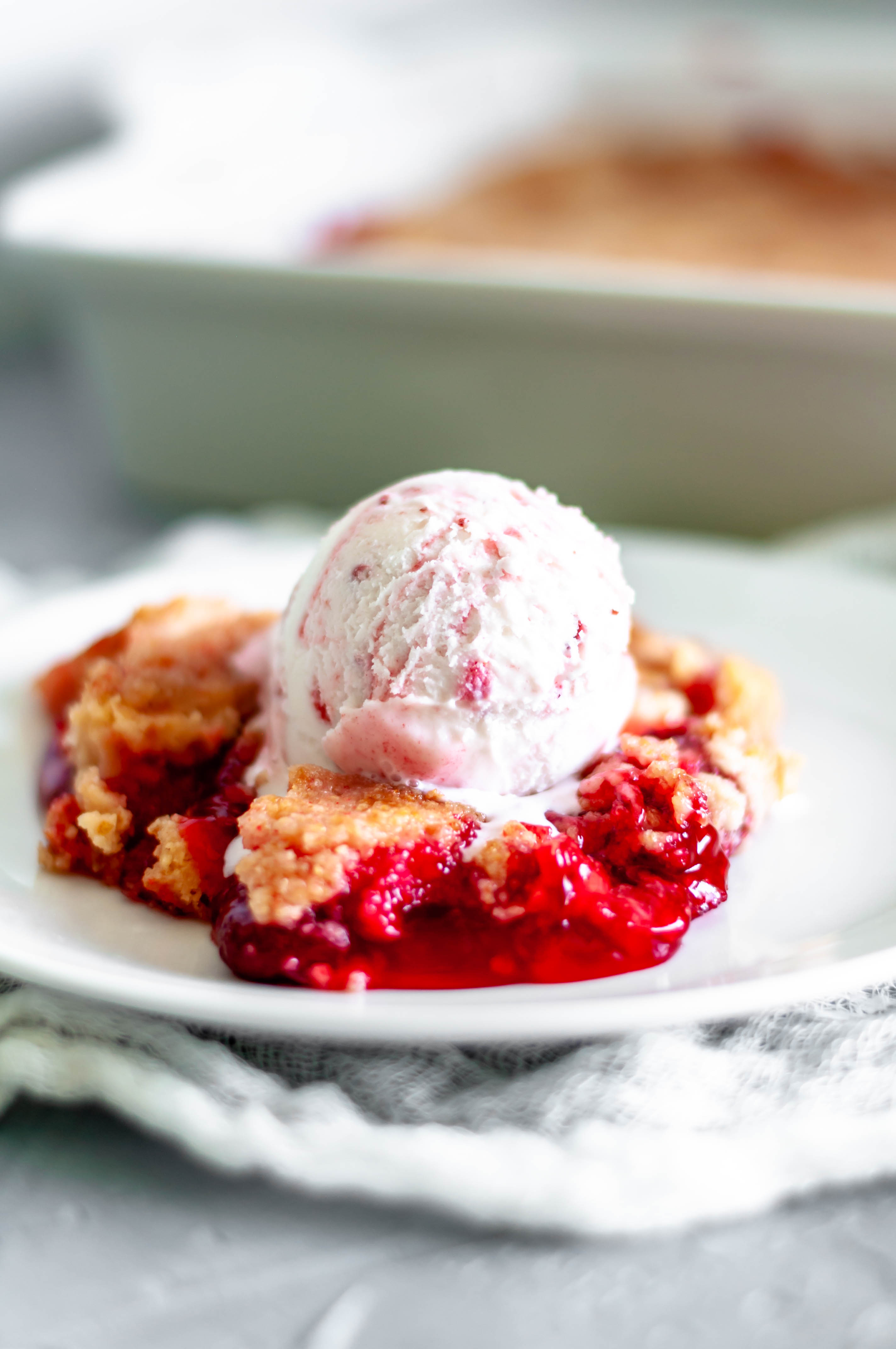 This Triple Strawberry Dump Cake is the perfect dessert for all your summer gatherings and potlucks. Just 4 simple ingredients to make this flavorful, texture filled cake.