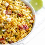 This Grilled Corn Salad with Bacon and Jalapeno is your next potluck dish. Sweet grilled corn, smoky bacon, spicy jalapeno and a bright lime dressing.