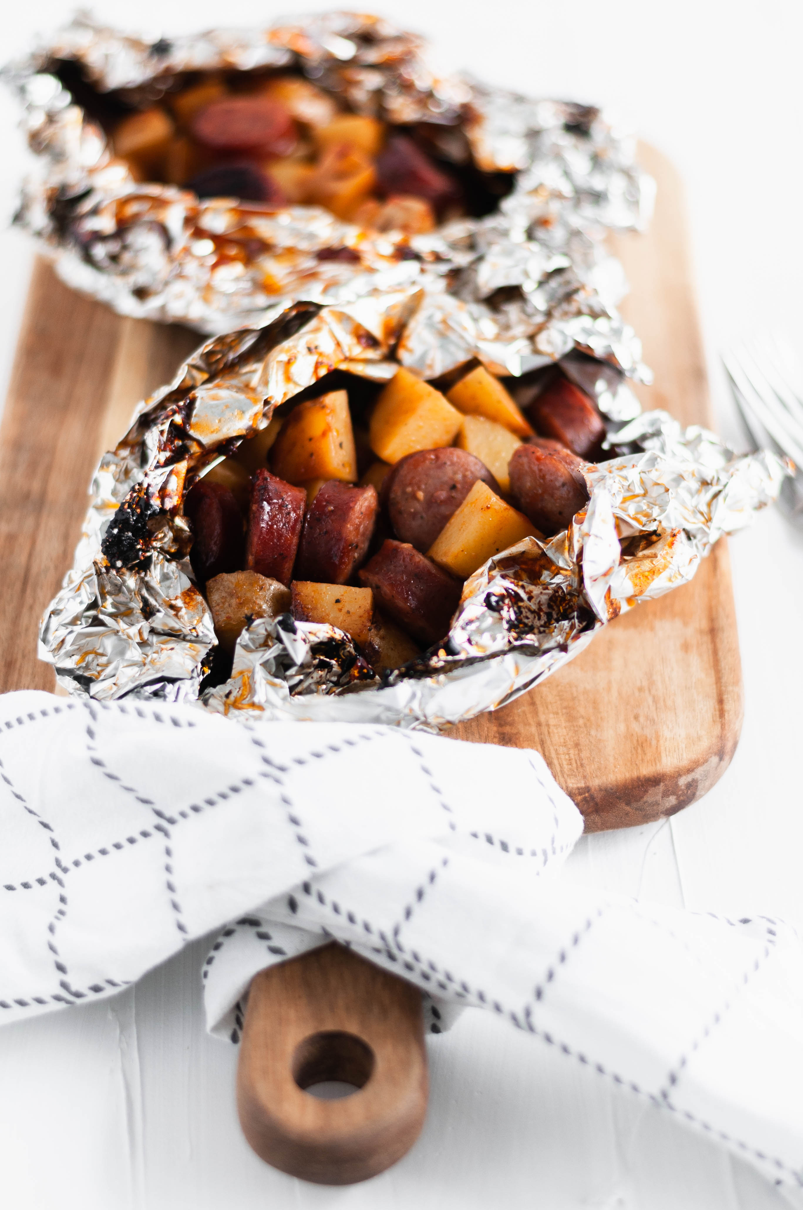 These BBQ Sausage Foil Packs come together in a snap and are done in 30 minutes making them perfect for busy weeknights. Sliced sausage, potatoes and BBQ.