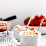 Combine two childhood classics with this Peanut Butter and Jelly Ice Cream. Smooth, creamy peanut butter ice cream, crumbled vanilla cookies and a jelly swirl.