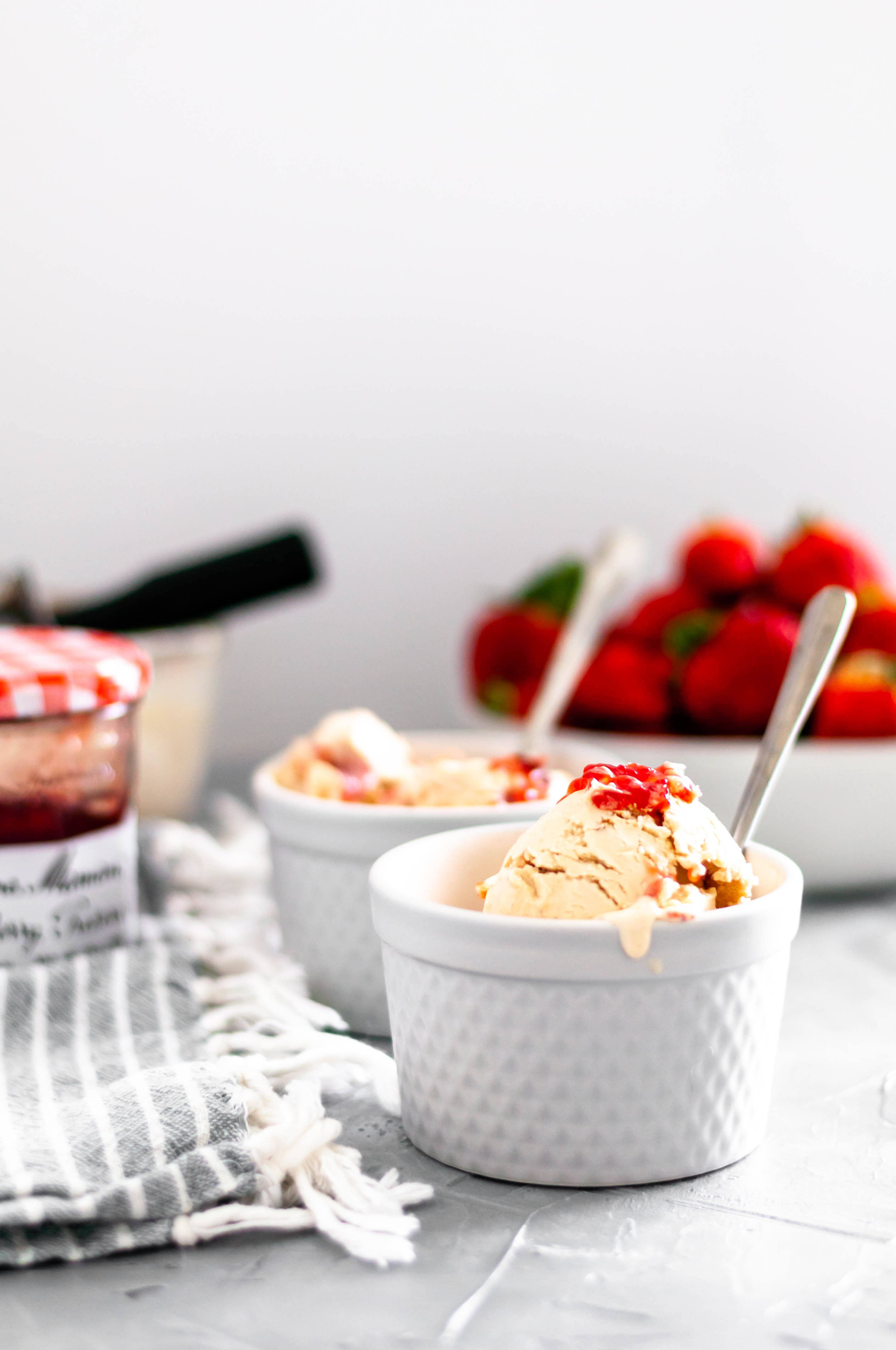 Combine two childhood classics with this Peanut Butter and Jelly Ice Cream. Smooth, creamy peanut butter ice cream, crumbled vanilla cookies and a jelly swirl.