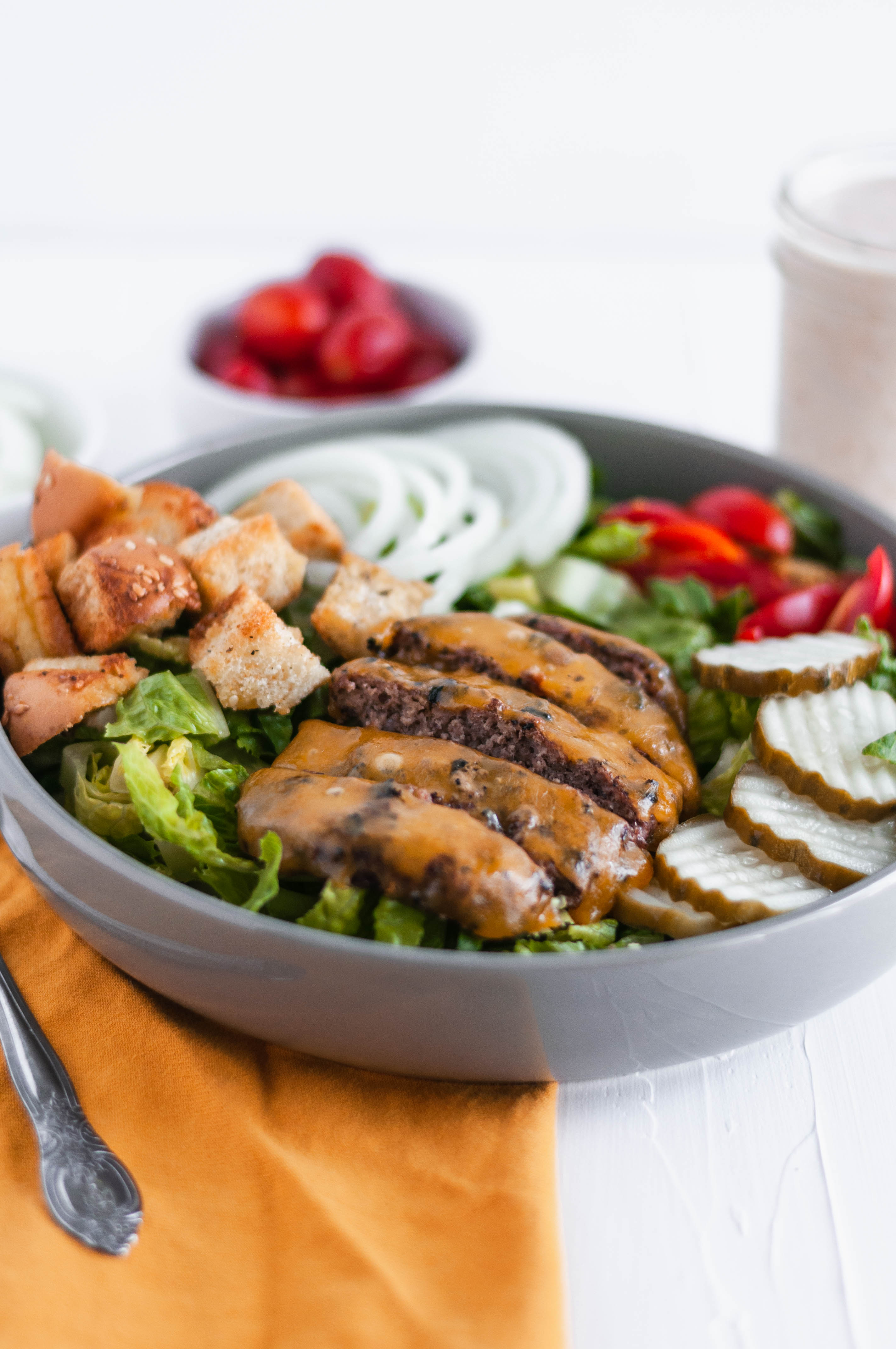 Lighten up your favorite summer main dish with this Cheeseburger Salad. All the delicious flavors from a cheeseburger atop a big bed of lettuce.