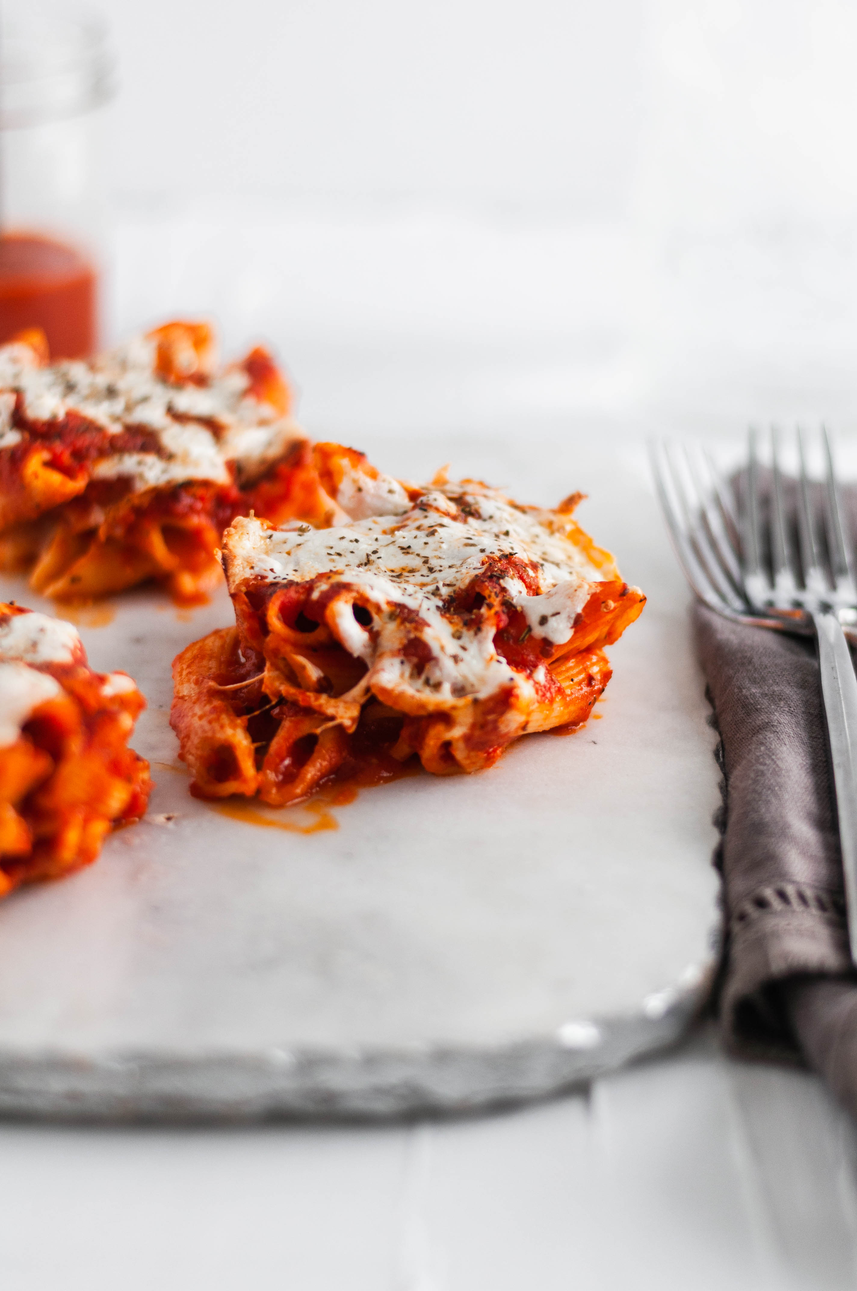 These Individual Baked Penne are SO simple and fun for a weeknight meal. Only 4 ingredients and 30 minutes required for these cute little bites.