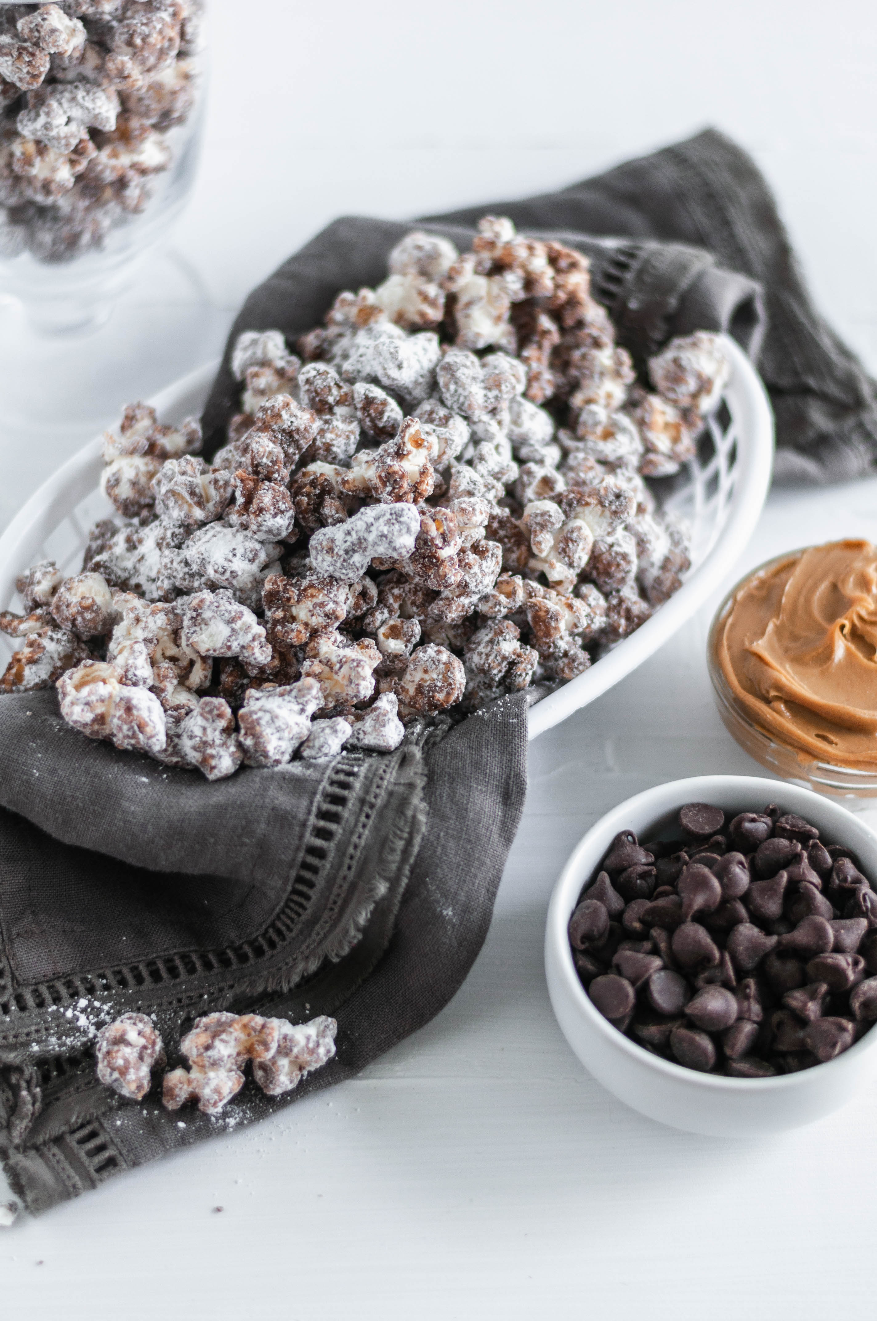 Update your game day snacking with this Puppy Chow Popcorn. Peanut butter and chocolate coated popcorn tossed in powdered sugar. Addiction ahead.