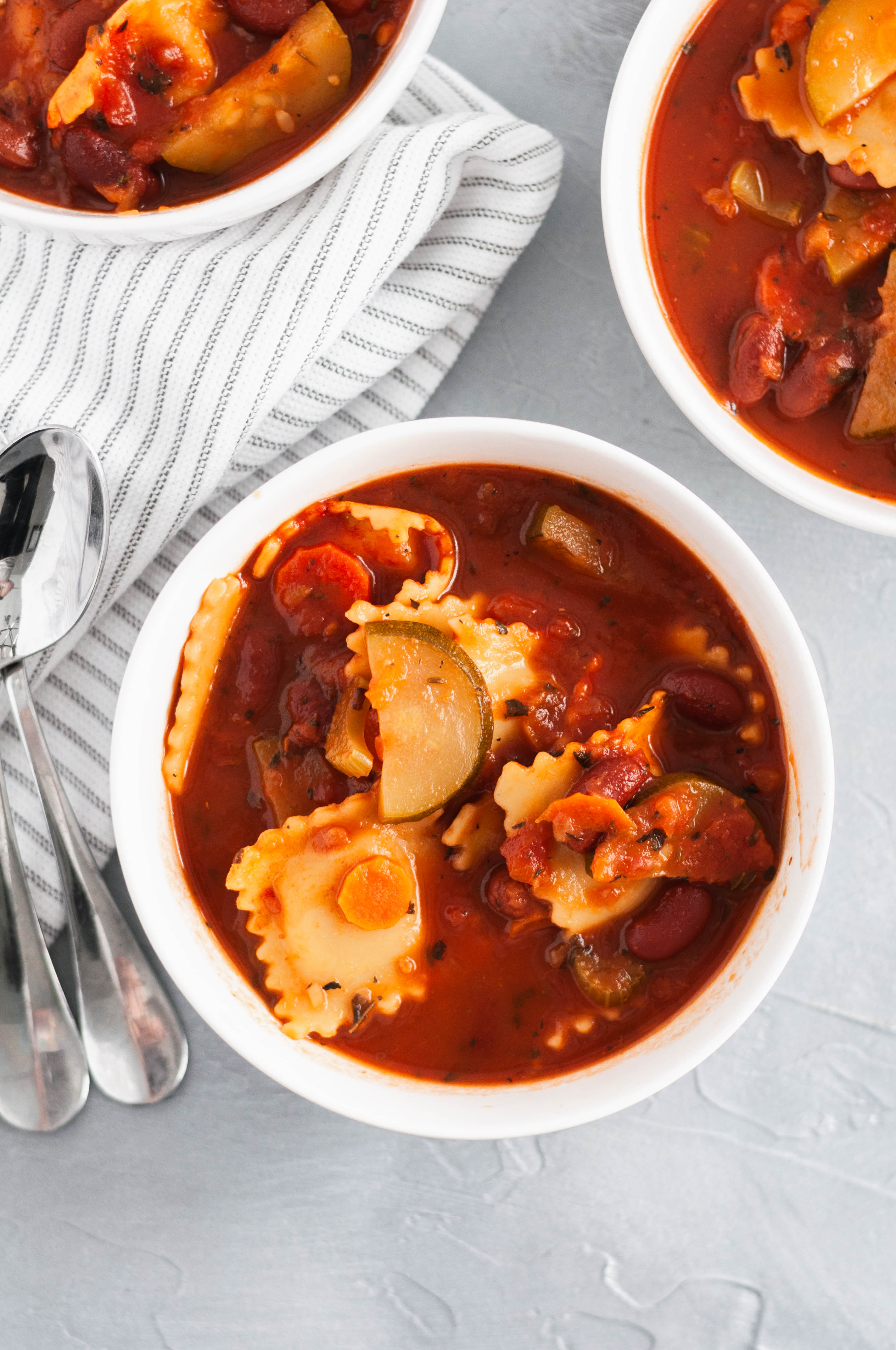 This hearty, filling Minestrone Soup with Cheese Ravioli is a fun twist on a classic soup. Vegetarian, family friendly and only 30 minutes needed.