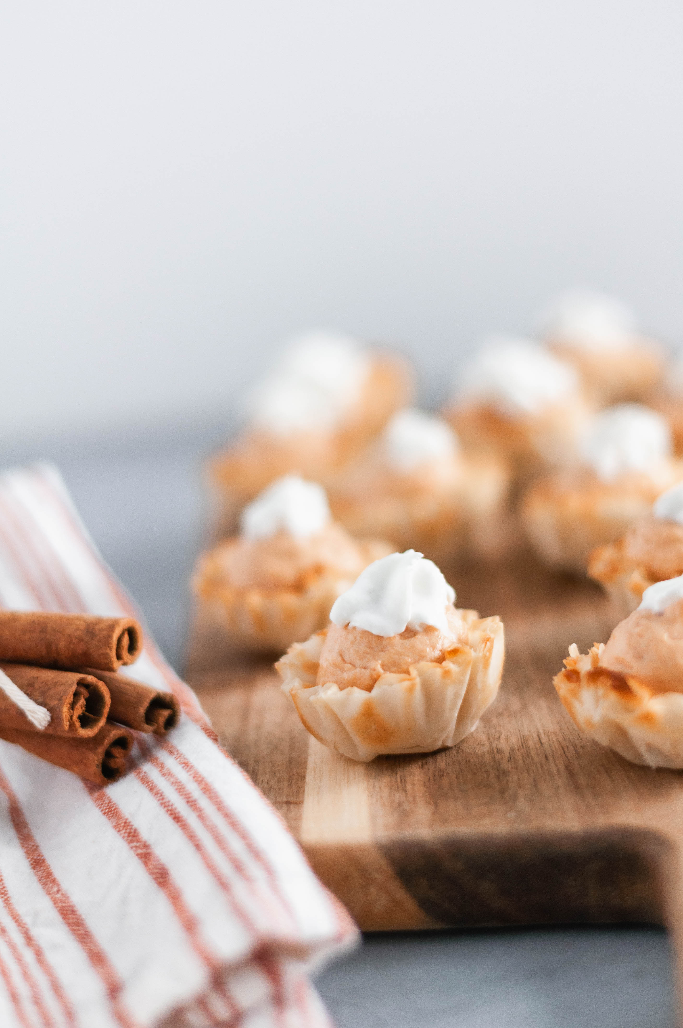 Mini Pumpkin Cheesecake Bites are a super simple dessert recipe everyone will love this fall. No bake pumpkin cheesecake filling and crispy dessert shells.