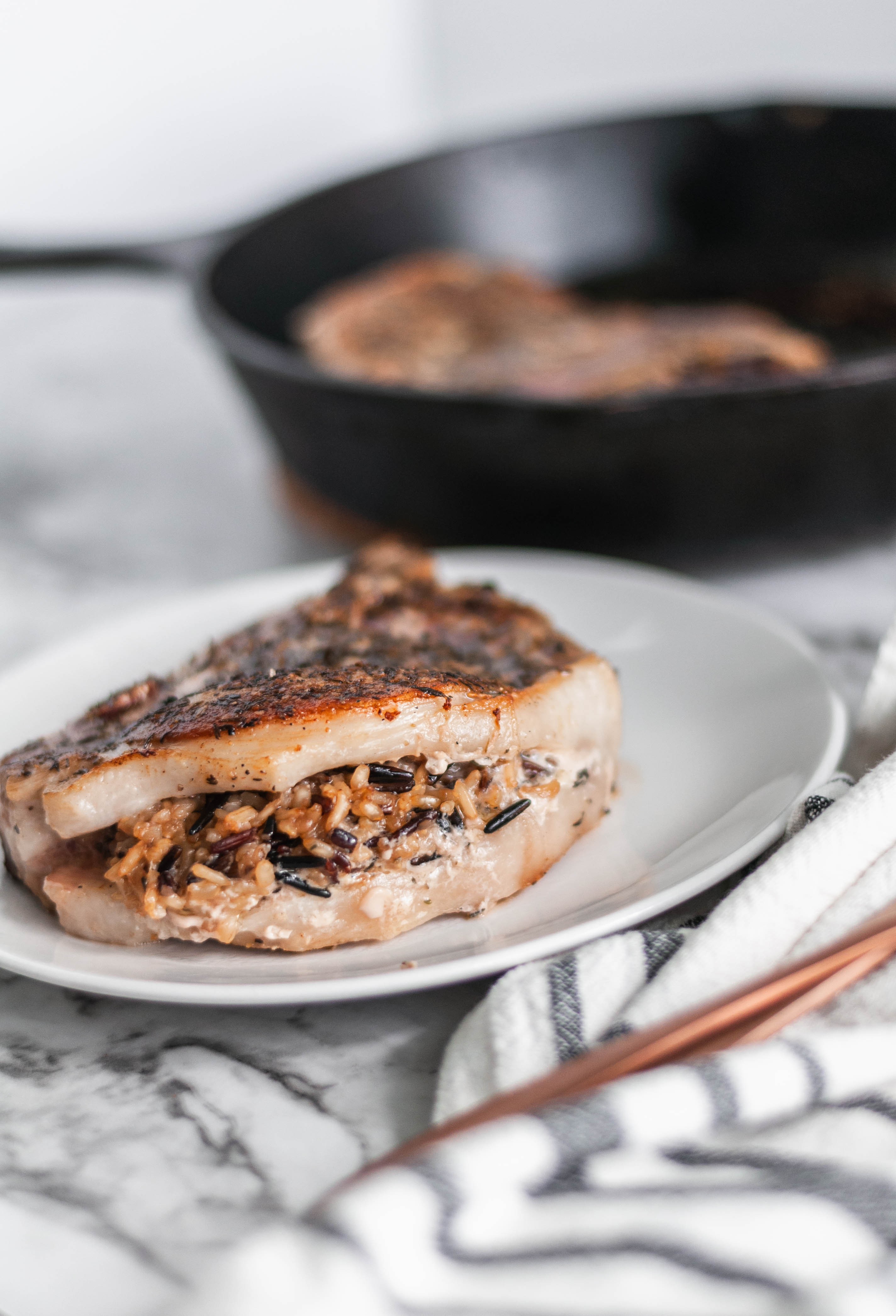 We're getting a little fancy here today but no worries, as always the recipe involves just a handful of easy to find ingredients. These Stuffed Pork Chops with Wild Rice are easy enough for a weeknights but dressed up enough for guests.