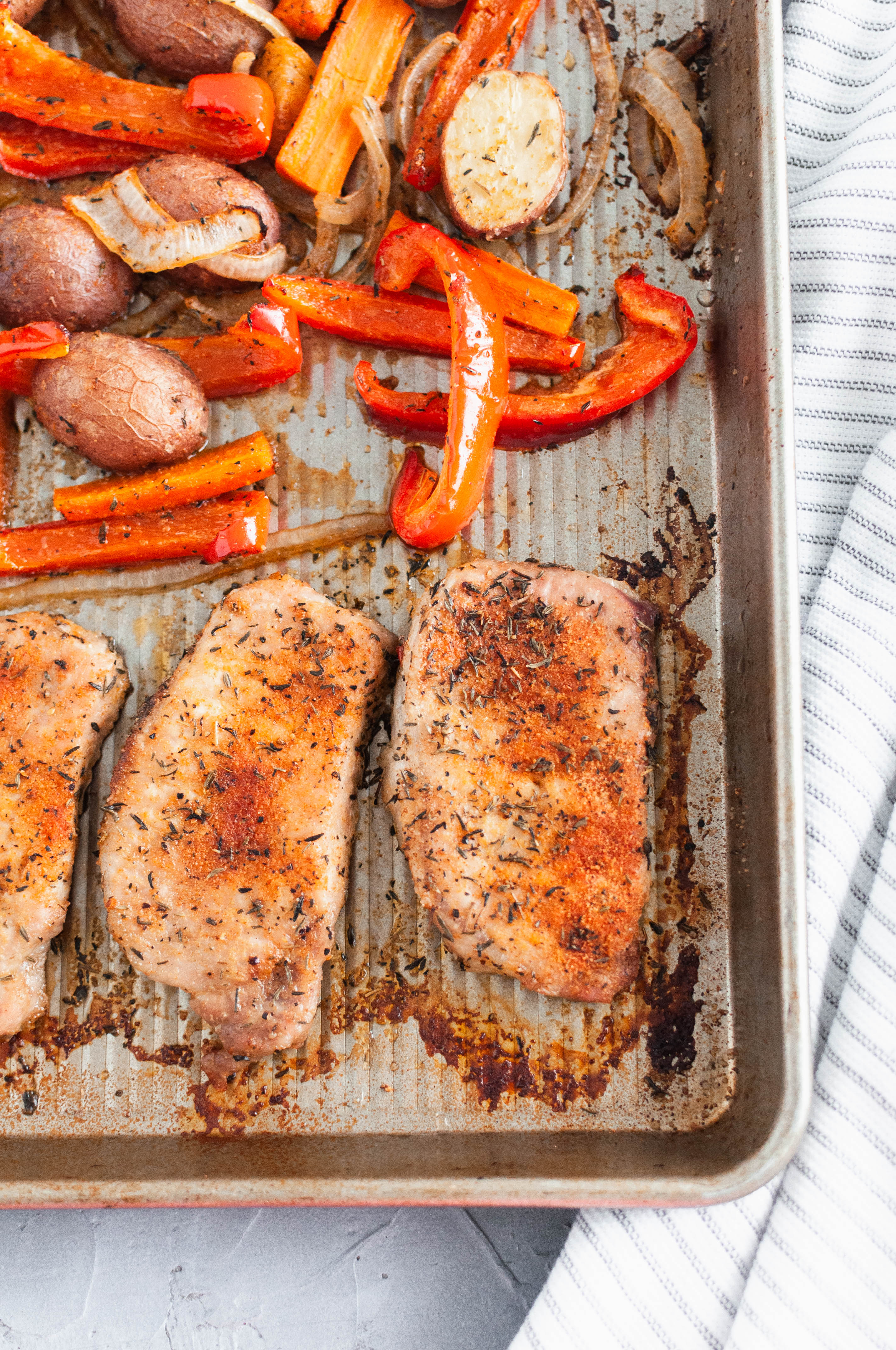 If you need a quick, simple weeknight dinner, look no further. This Sheet Pan Pork Chops and Vegetables is all cooked on one pan in less than 30 minutes and packed with flavor.