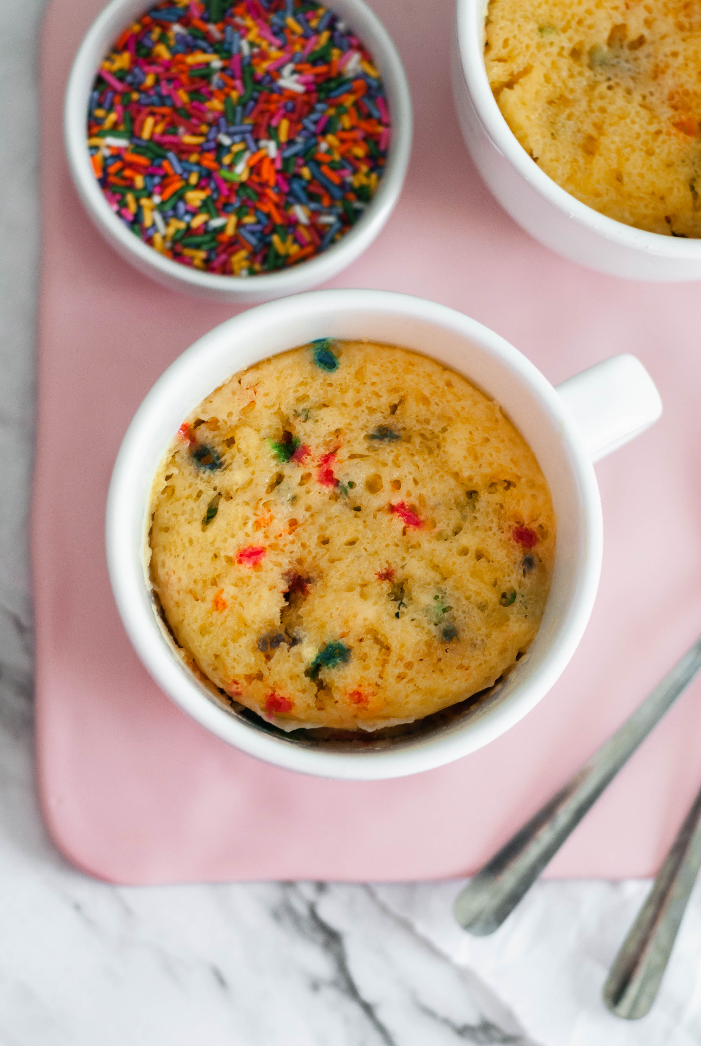 This funfetti Microwave Mug Cake is the perfect solution to your late night sweet tooth craving. Just a handful of ingredients and a few minutes to dessert.